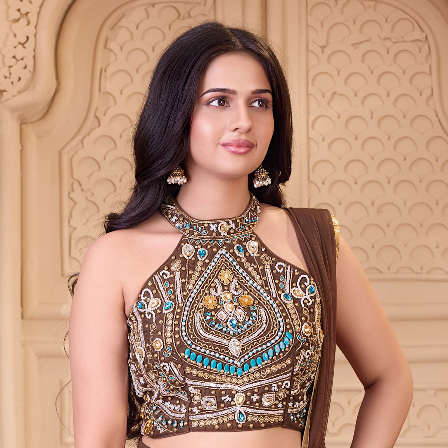 Close-up of ladies brown embroidered halter top